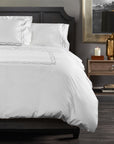 arezzo duvet cover with a chain embroidered detail shown in color shadow & white 