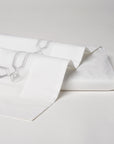 arezzo embroidered flat sheet in the color shadow & white. Pattern features 15" repeats, 