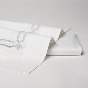 arezzo embroidered flat sheet in the color shadow & white. Pattern features 15" repeats, #color_shadow & white