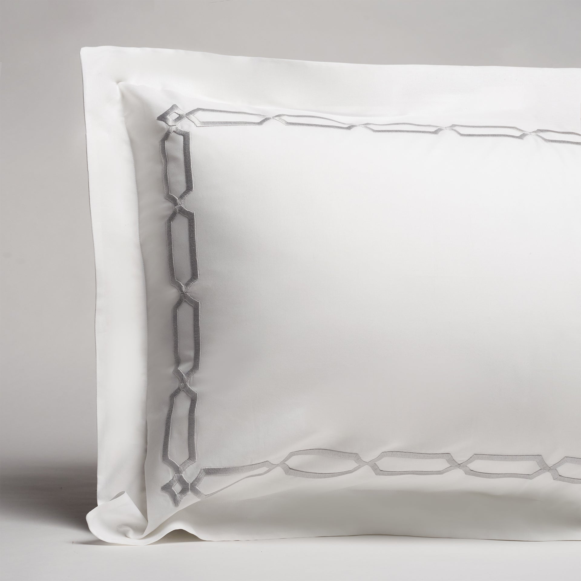 arezzo embroidered sham in the color shadow &amp; white with a frame style pattern featuring 15&quot; repeats, 
