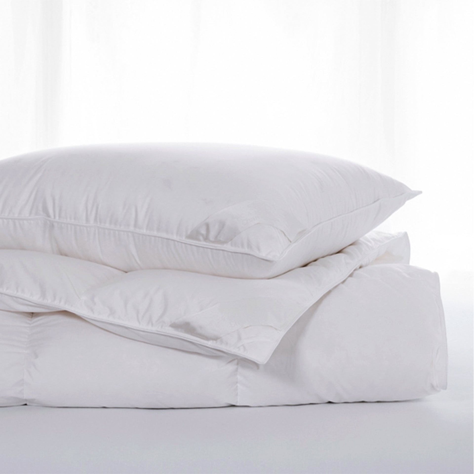 scandia home chamonix pillow on top of folded chamonix comforter 