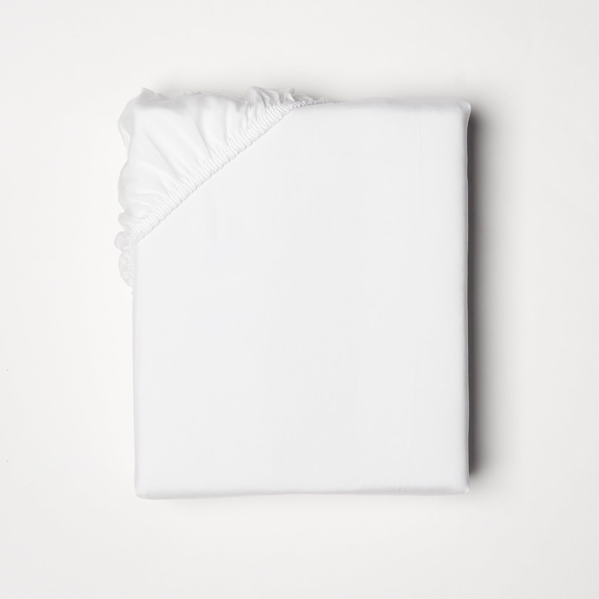 Fitted sheet offered in classic ivory and white, fits mattresses up to 18" deep with a fitted elastic skirt 