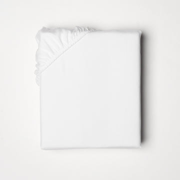 Fitted sheet offered in classic ivory and white, fits mattresses up to 18" deep with a fitted elastic skirt 