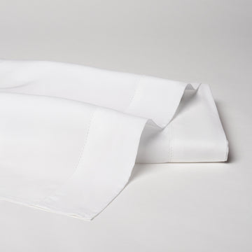 Offered in classic ivory and white, with an attractive hemstitch border on the flat sheets and pillowcases.