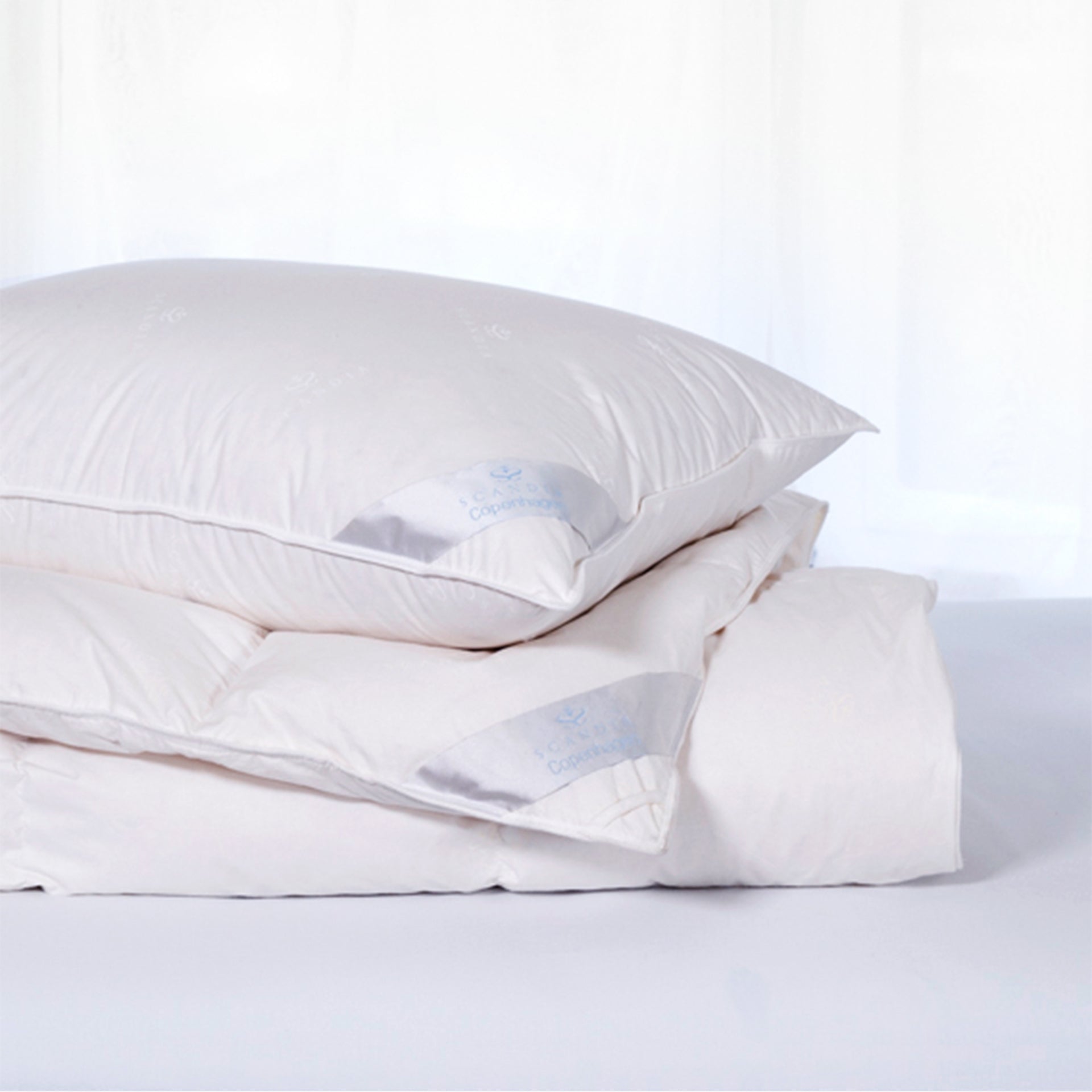 scandia home copenhagen comforter and pillow filled with european white down on bed