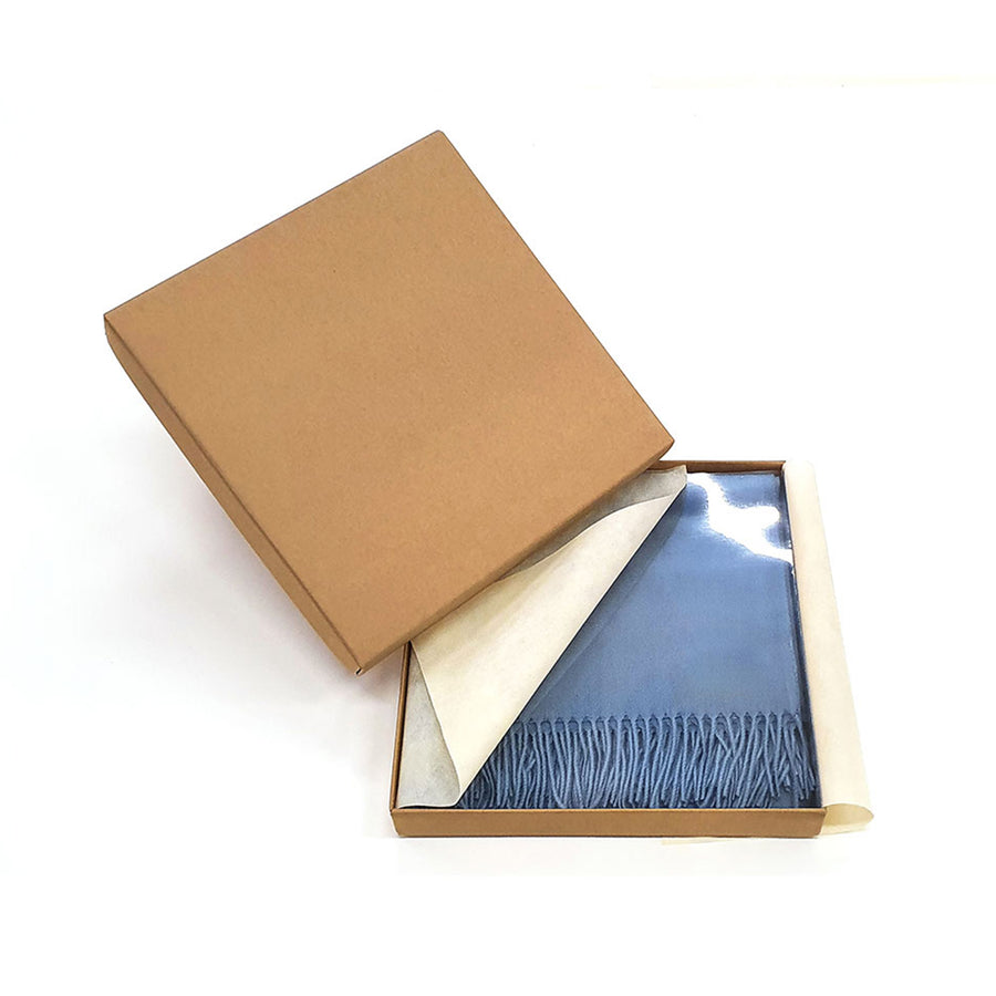 a luxuriously soft and silky reversible cashmere throw. Offered in five classic colors.