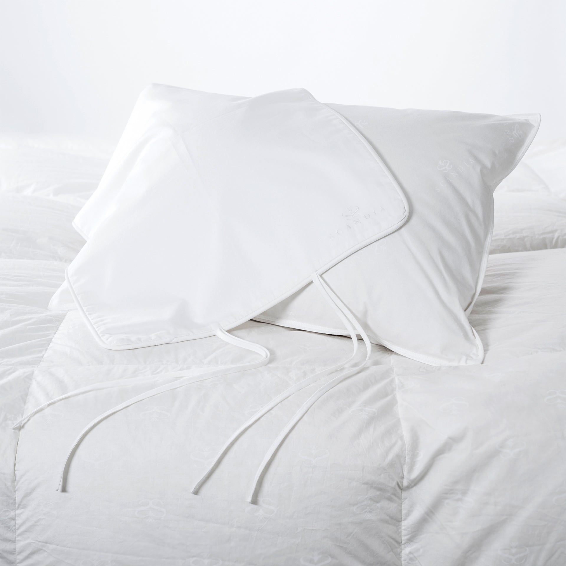 a standard size travel pillow filled with 650 hungarian white goose down with a pillow case made of eygptian cotton