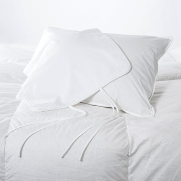 a standard size travel pillow filled with 650 hungarian white goose down with a pillow case made of eygptian cotton