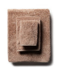 scandia home's indulgence wash, hand, and bath towel folded in the color truffle  #color_truffle