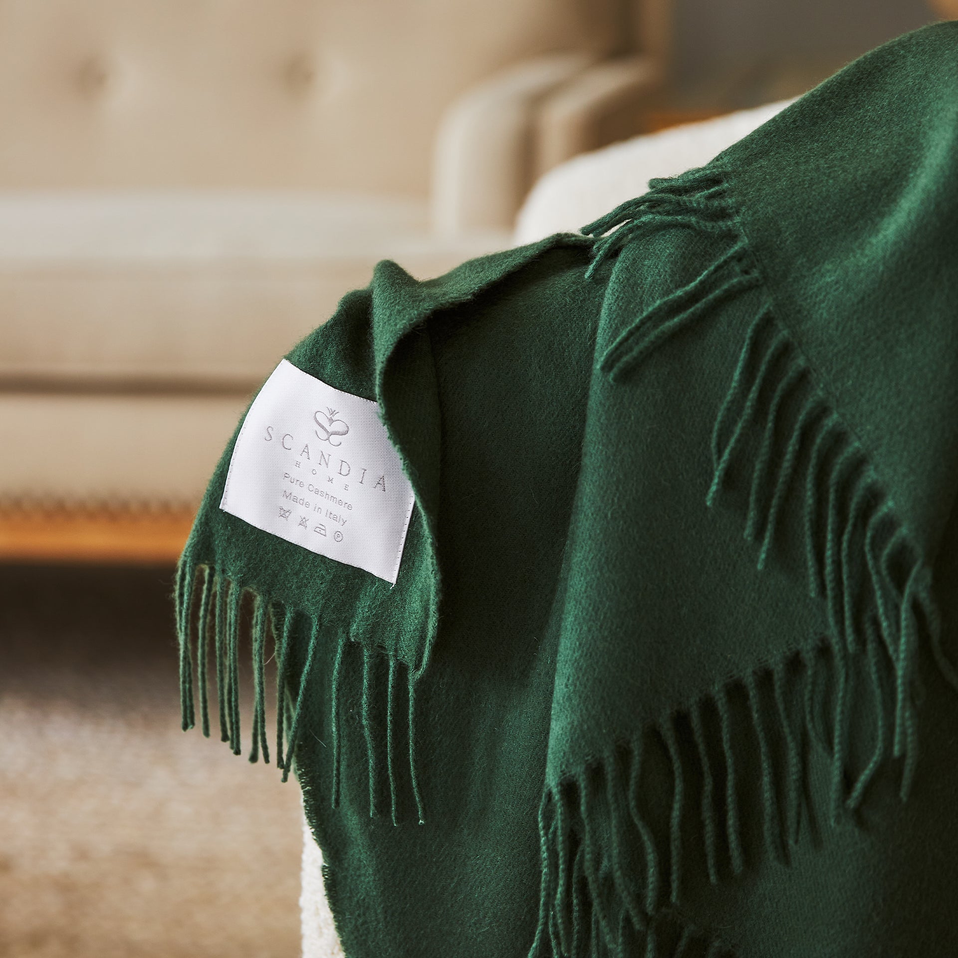 close up detail of scandia home label and fringe on the jaya cashmere throw