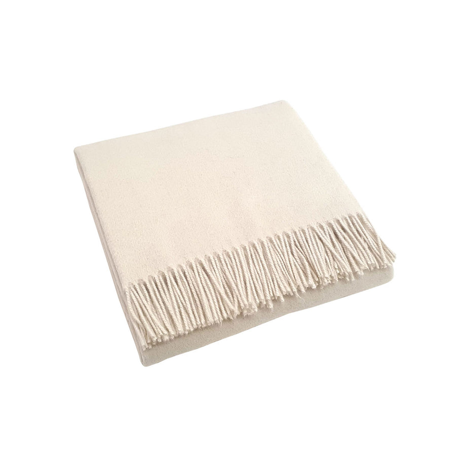 scandia home jaya cashmere throw folded in the color ivory