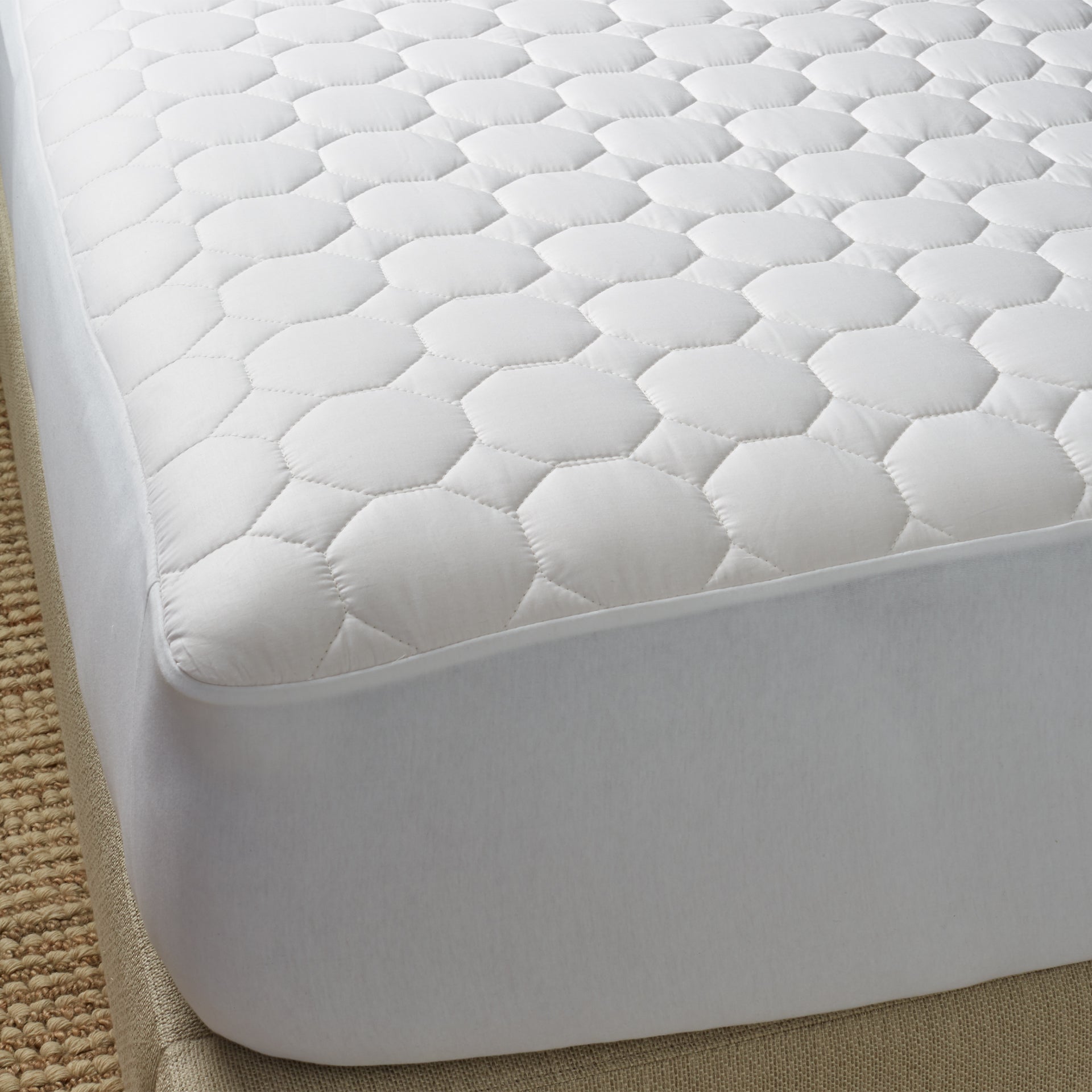 The pure cotton mattress pad encloses naturally hypoallergenic cotton batting in a pure cotton shell