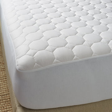 The pure cotton mattress pad encloses naturally hypoallergenic cotton batting in a pure cotton shell