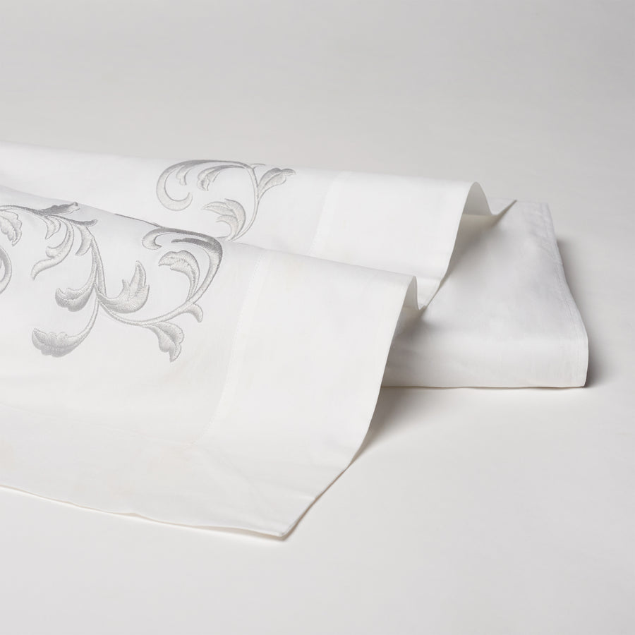 san remo embroidered flat sheet in the color shadow & white. Pattern features 15" repeats, #color_shadow & white