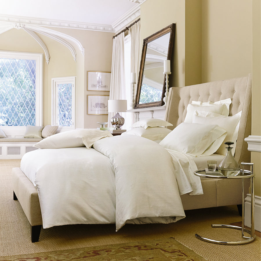 savoia duvet cover has a tone on tone strip patter shown the color ivory 