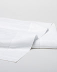 savoia stripe sateen flat sheet with a 4inch hemstitch finish shown in the color white