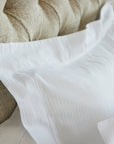 detail close up of the savoia stripe euro pillow sham with the 3 inch hemstitch flange