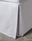 savoia stripe sateen tailored bedskirt in the color white with a three-panel, center-pleated construction