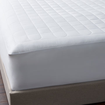 mattress pad is filled with tencel, a fiber known for its absorbency, breathability, and temperature-regulating properties